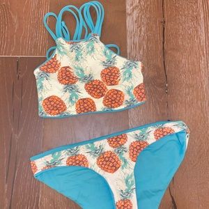 reversible blue and pineapple swim set